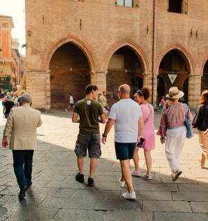 a group of people walking down a street