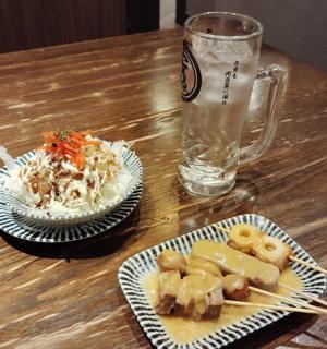 a table with two plates of food and a glass of water
