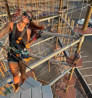a woman standing on top of a boat