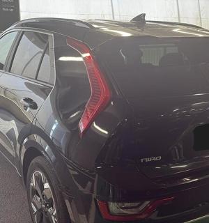 a black car parked in a parking lot