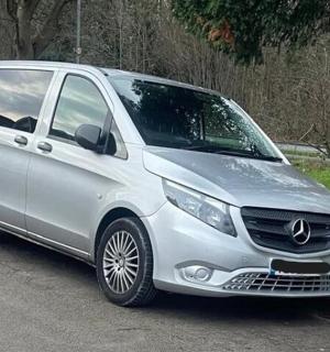 a silver van parked in a parking lot