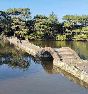 a stone bridge over a body of water