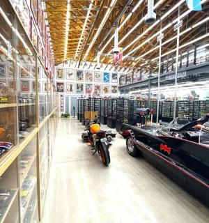 a warehouse with a motorcycle parked in the middle