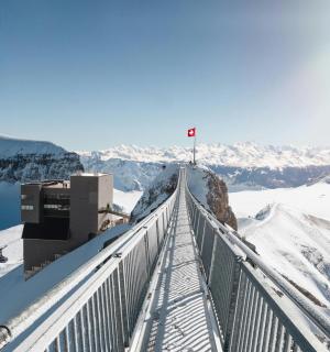 a walkway on top of a mountain in the snow