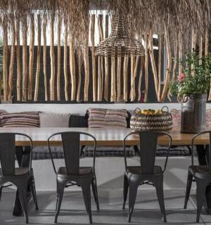 a dining room table with chairs and a couch