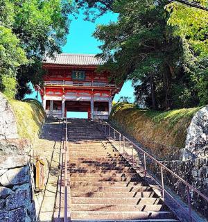 a stairway leading up to a red building