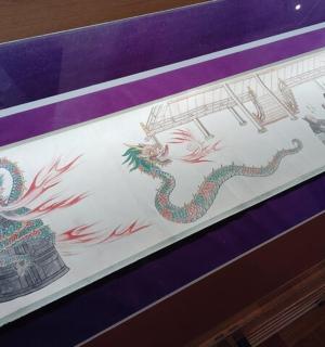 a painting of a dragon on a wall