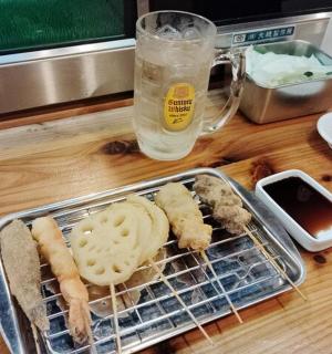 a table with a tray of food and a drink