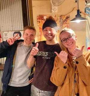 a group of three people giving the thumbs up