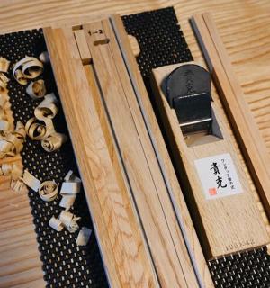 a wooden box with a bunch of objects in it