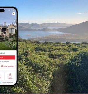 a cell phone taking a picture of a house
