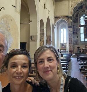 a man and two women standing in a church