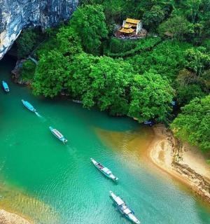 a group of boats in a river in a cave