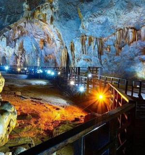 a room in a cave with lights in it