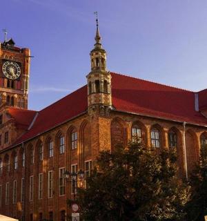 a large brick building with a clock tower