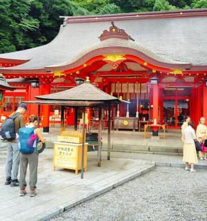 a group of people standing in front of a temple