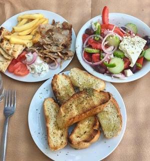 a table with three plates of food on it