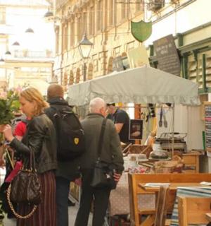 a group of people standing in a market