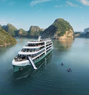 a large boat on a river with two people in the water