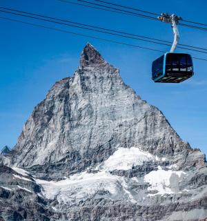 a mountain with a ski lift in front of it