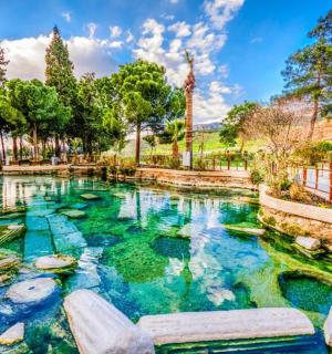 a swimming pool in a park with blue water