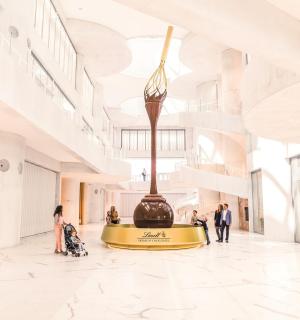a rendering of the lobby of a museum with a large vase