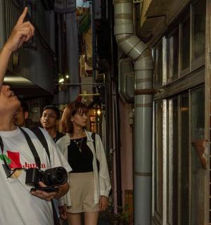 a man taking a picture of a woman with a camera