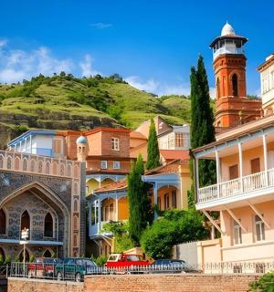 a group of buildings with a lighthouse in the background