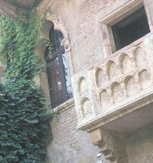 a building with a balcony on the side of it