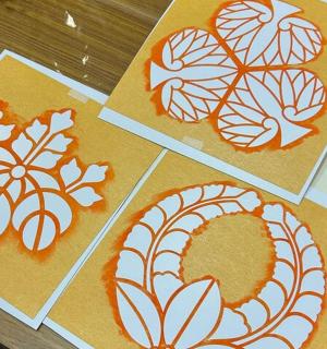 four pictures of drawings of leaves on paper