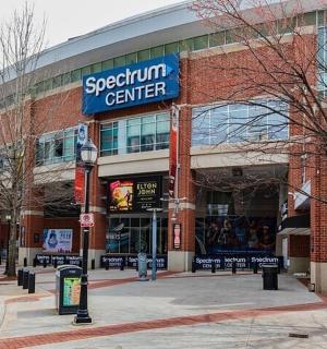 a large brick building with a sign for a gemini center