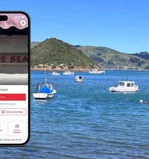 a iphone displaying a website with boats in the water