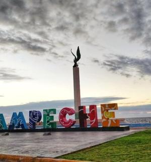 a sign for a beach with the word ocean