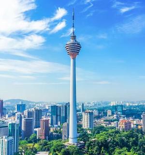 a view of a city with a tall tower