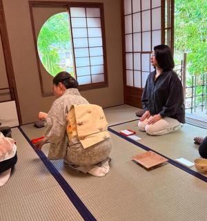 a group of women sitting on the floor in a room