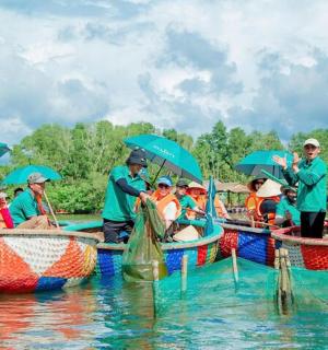 a group of people on boats in the water with umbrellas