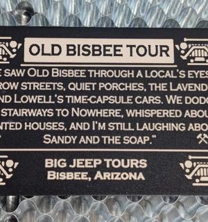 a sign for an old bicycle tour on a display