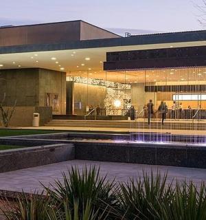 a building with a fountain in front of it