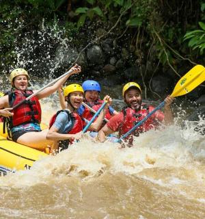 a group of people on a raft in the water