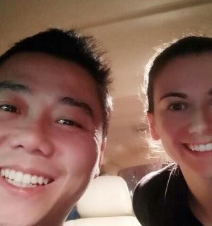 a man and a woman sitting in a car