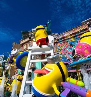 a carnival parade with a lot of inflatable rubber ducks