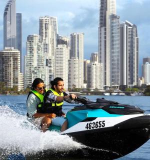 two people riding on a jet ski in the water