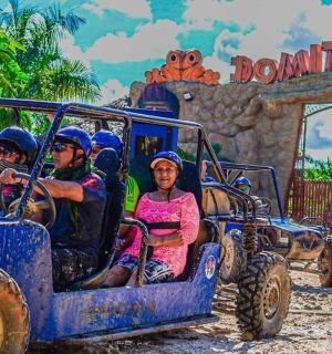 a group of people riding in an off road vehicle