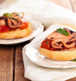 two plates of food on a wooden table