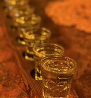 a row of glasses sitting on top of a table