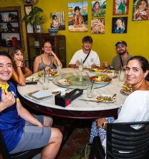 a group of people sitting around a table