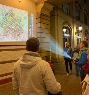 a group of people walking down a street