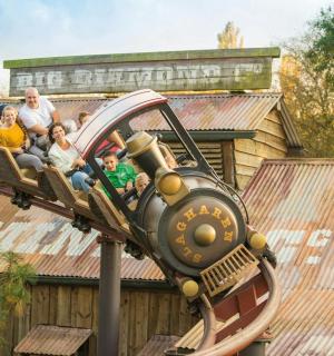 a group of people riding on a roller coaster
