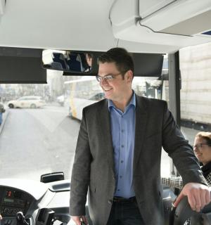 a man is standing in a bus