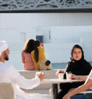 a group of people sitting around a table